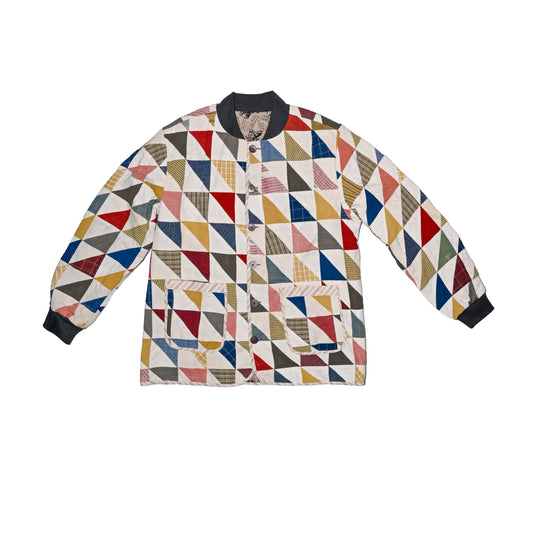 A reversible multicolour patchwork jacket made in cotton with  inner lining made of contrast hand printed cotton. 