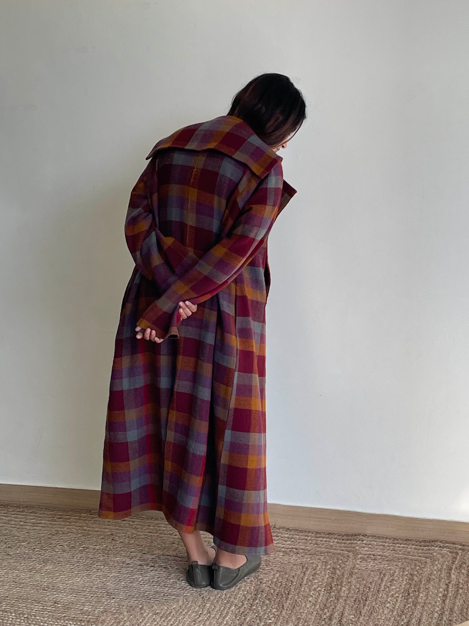 Handwoven soft merino wool long jacket in berry coloured checks. 