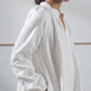Oversized white khadi cotton dress with high and low hem