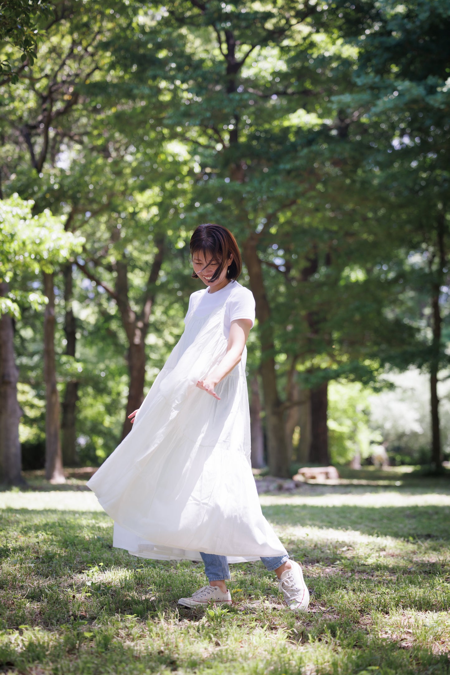 White three tier dress with comfortable straps and a very large fllare. 