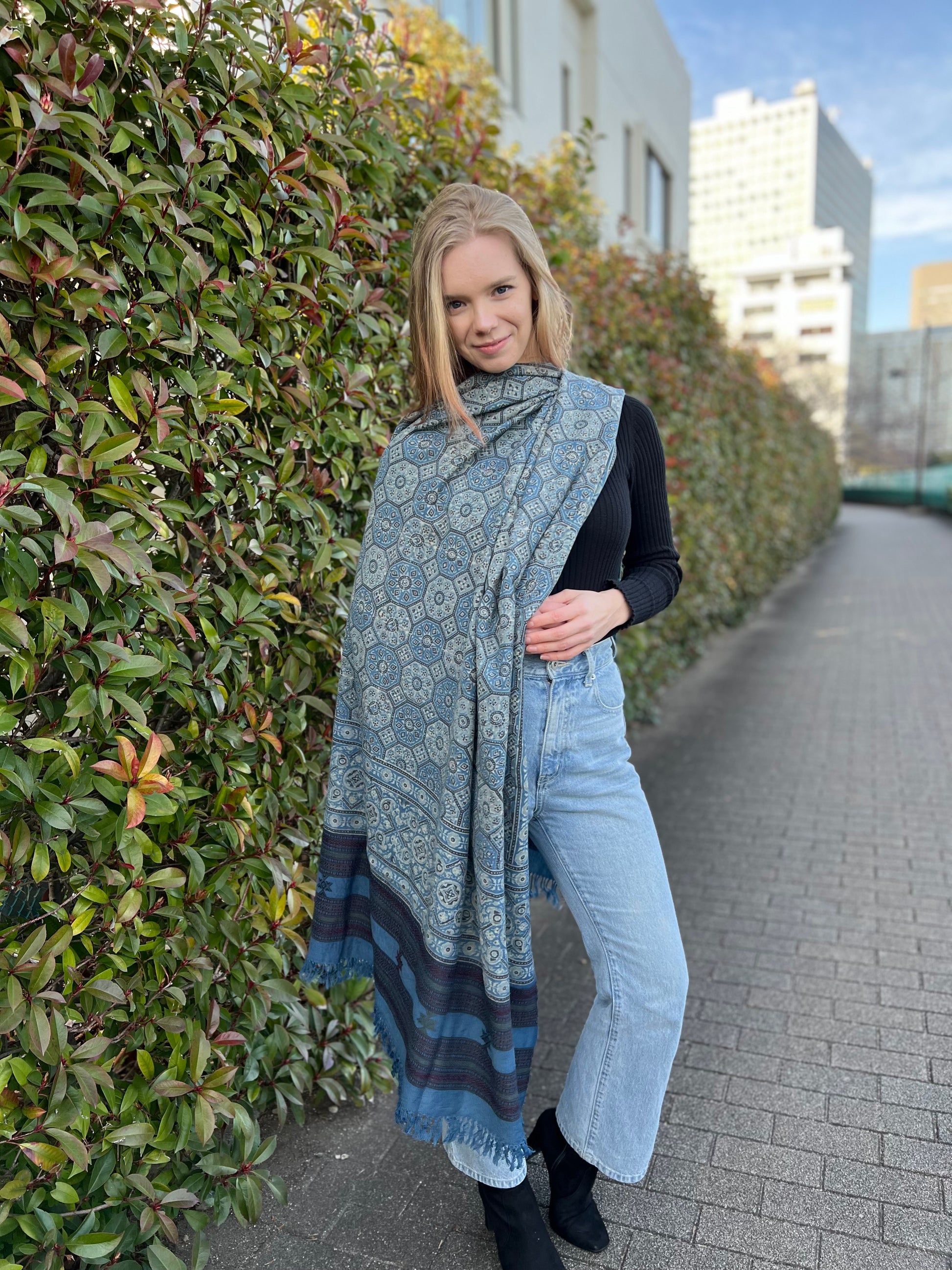 hand woven merino wool shawl with all over ajrakh hand block print in shades of blue using natural colours.