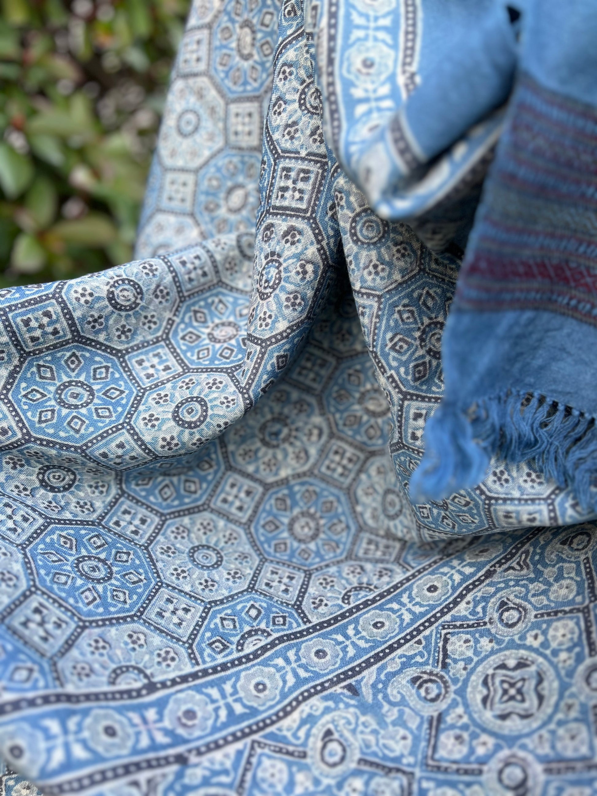 hand woven merino wool shawl with all over ajrakh hand block print in shades of blue using natural colours.