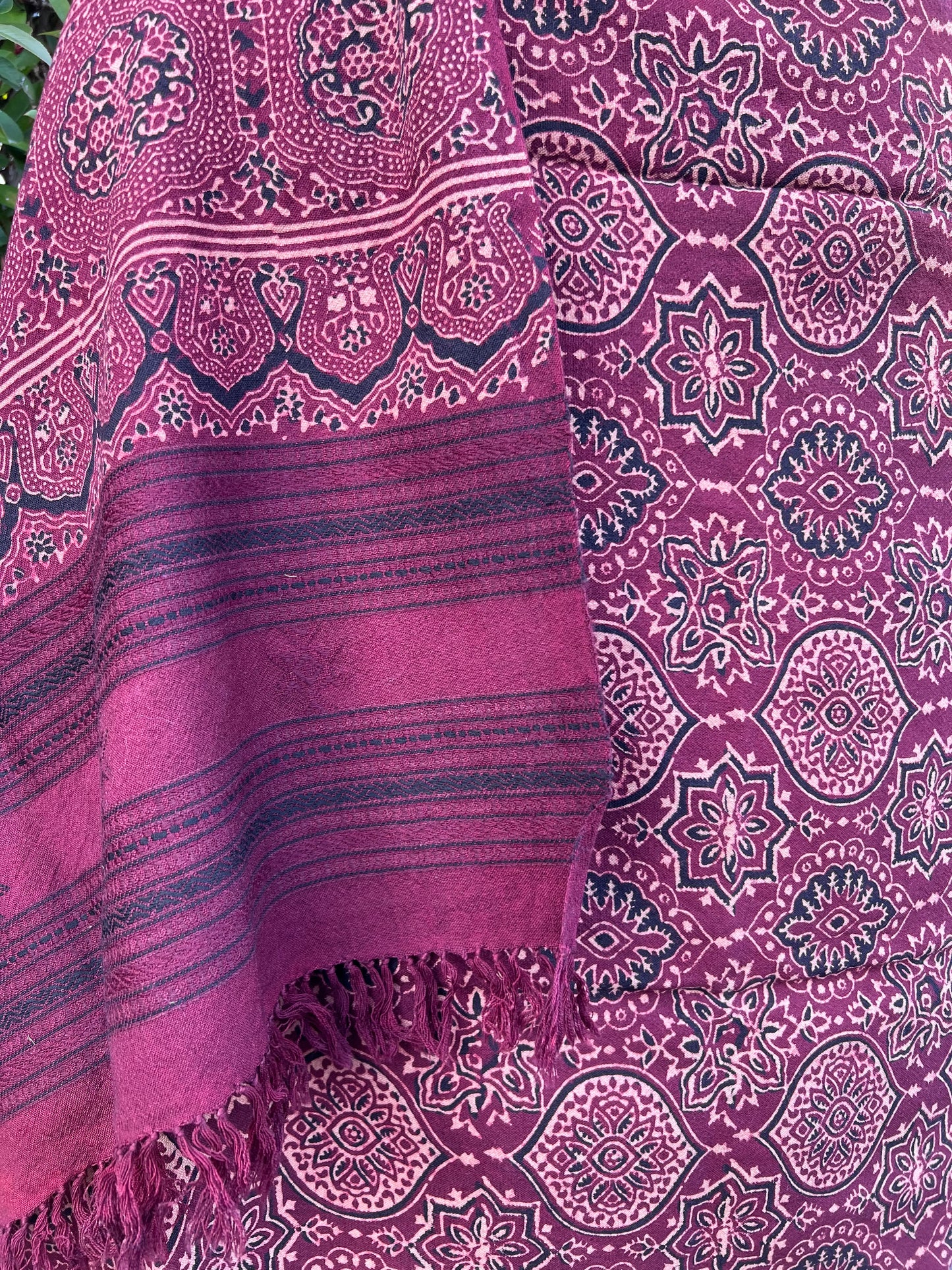 hand woven merino wool shawl with all over ajrakh hand block print in shades of deep red using natural colours. 